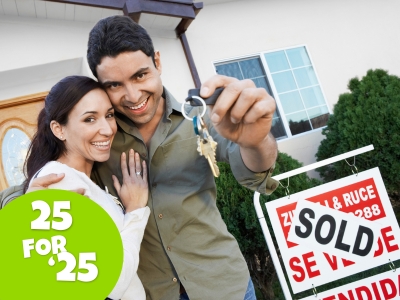 couple stands beside a SOLD sign holding keys to their new home. 25 for '25 tips for homeowners