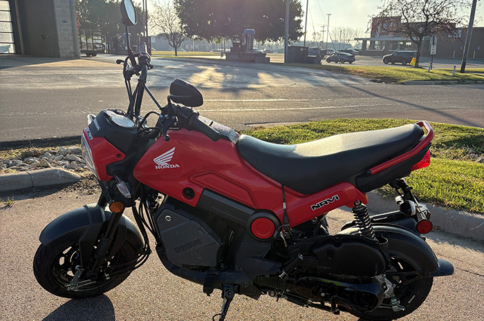 2023 red Honda Navi motorcycle