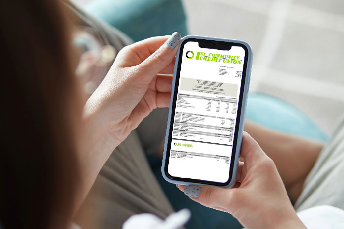 over the shoulder image of someone looking at a statement on their phone