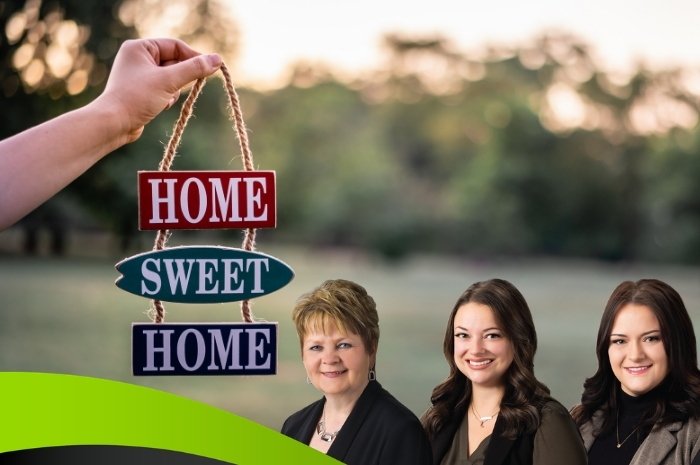 Man with lawn mower hand holding decorative Home Sweet Home sign