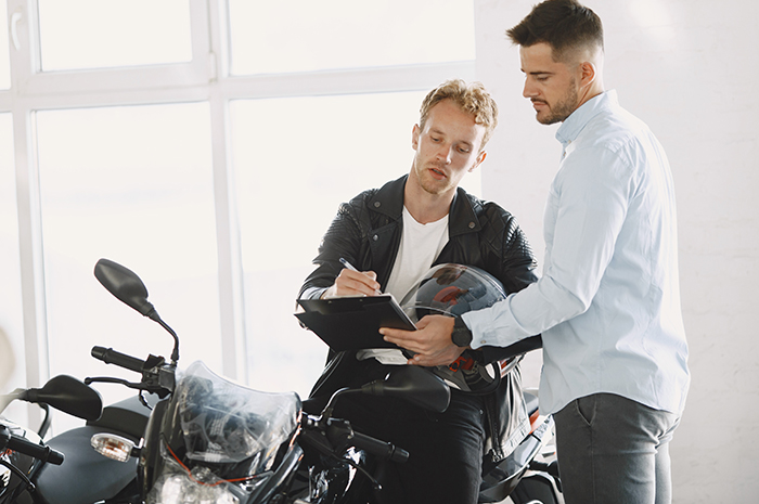 man with motorcycle salesman